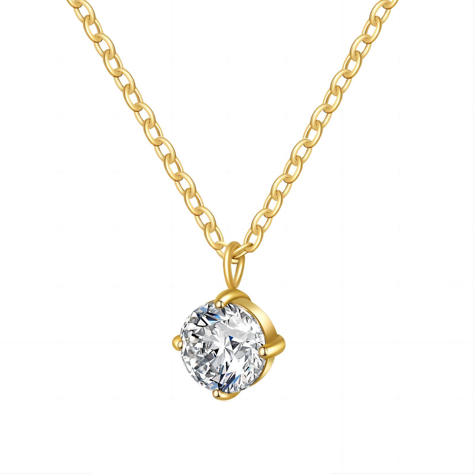 Gold necklace with acubic zirconia stone pendant on a white background