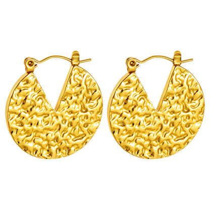 Pair of gold hoop earrings with textured design on a white background