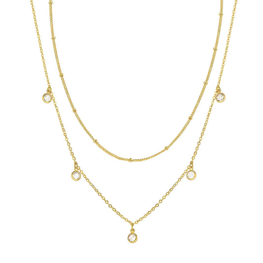Dual gold layer necklaces on a white background
