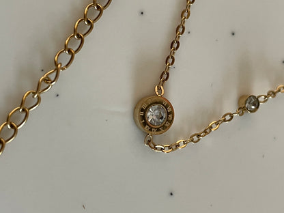 Gold Bracelet with Cubic zirconia stones on a light background
