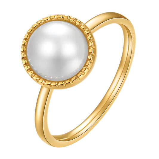 Gold ring with a white pearl on a white background